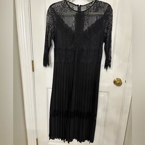 Black lace 3/4 sleeves and bodice, pleated skirt